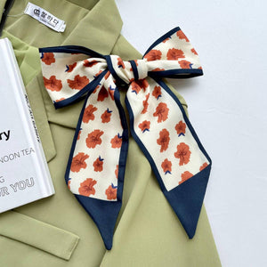 
                  
                    Rust Floral & Navy Twilly Scarf
                  
                